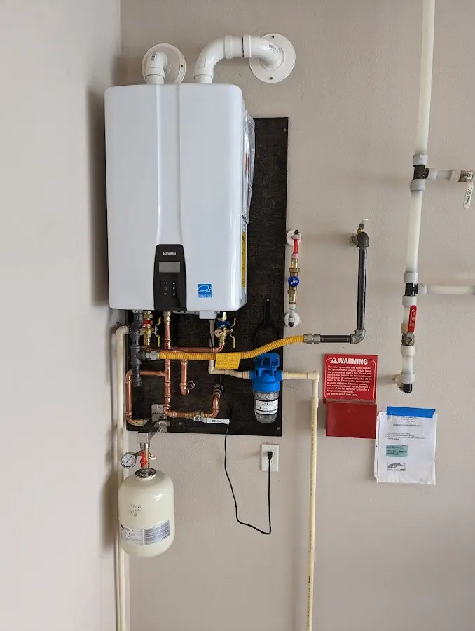 Professional plumber installing copper piping in a Destrehan home